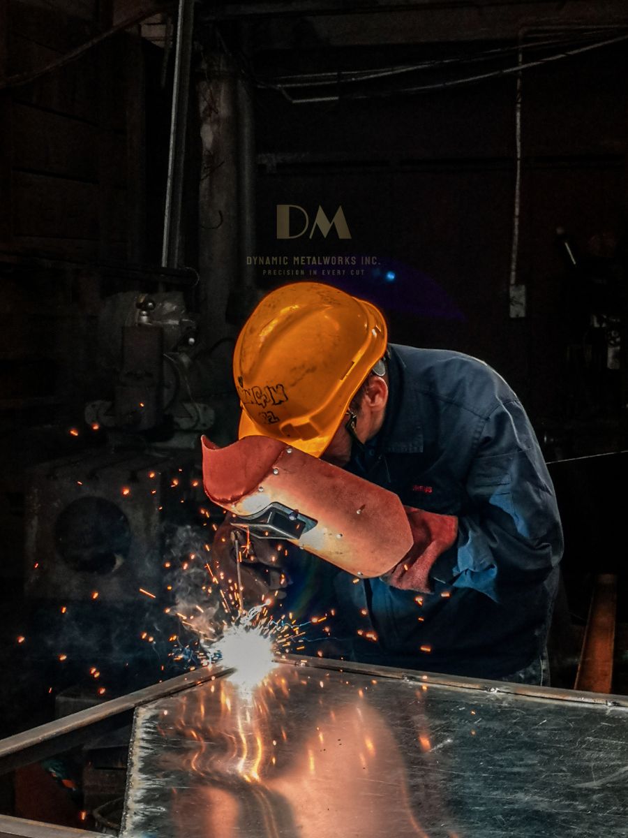 a technician welding, for dynamic metalworks inc.